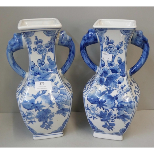 375 - A pair of oriental blue and white porcelain vases