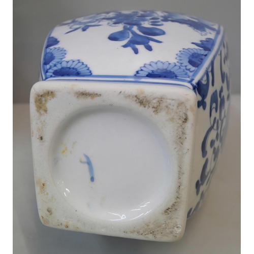 375 - A pair of oriental blue and white porcelain vases