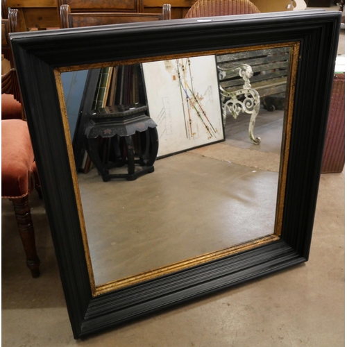 382 - A Victorian style ebonised and parcel gilt framed mirror