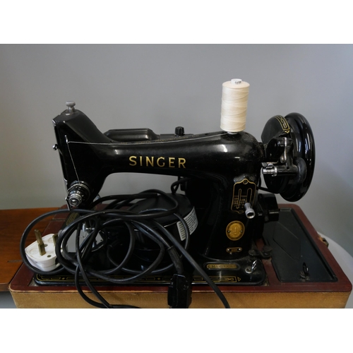 383 - A cased Singer sewing machine