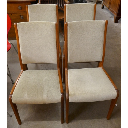 49 - A set of four teak dining chairs