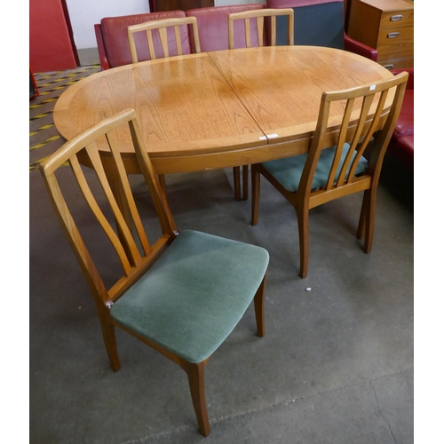 50 - A Nathan teak extending dining table and four chairs