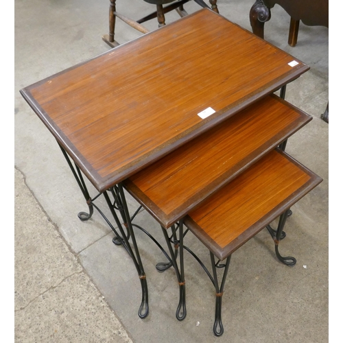 51 - An Italian style teak and wrought iron nest of tables