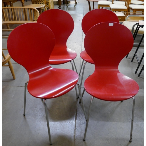 61 - A set of four Rondo style red plywood and chrome chairs