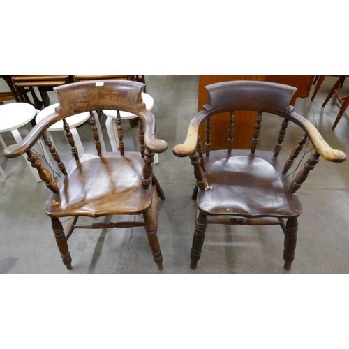 65 - A pair of Victorian elm and beech smokers bow chairs