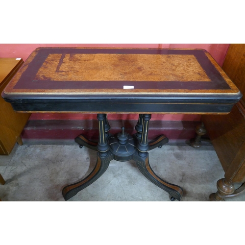 66 - A Victorian ebonised and amboyna rectangular fold over card table, manner of Lambs, Manchester