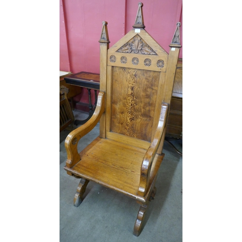 71 - A Victorian Gothic Revival pitch pine throne chair, manner of A.W.N. Pugin