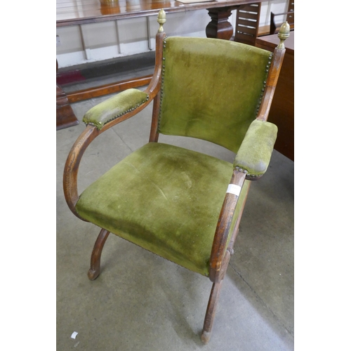 72A - A Victorian oak and green fabric X frame chair