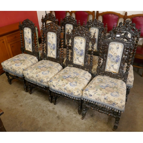 73 - A set of eight Victorian Jacobean Revival carved oak dining chairs