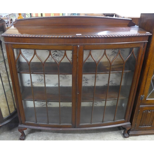 78 - An early 20th Century mahogany two door bow front display cabinet