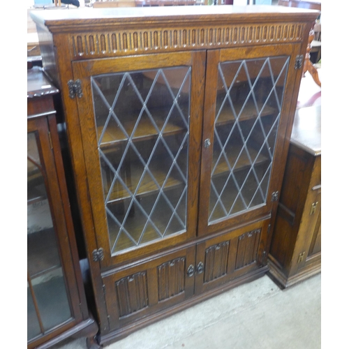 79 - An oak four door bookcase