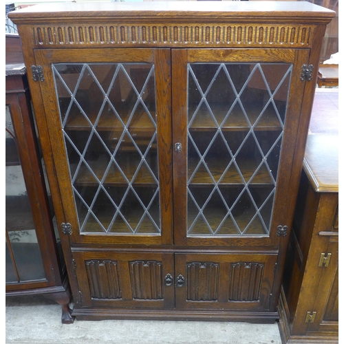 79 - An oak four door bookcase