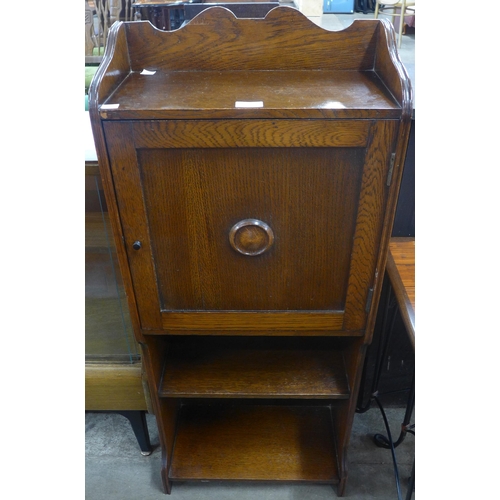 83 - An oak single door open bookcase