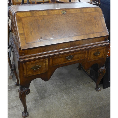 84 - A Queen Anne style walnut bureau de dame