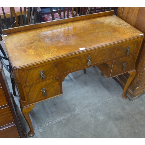 88 - A Queen Anne style figured walnut desk