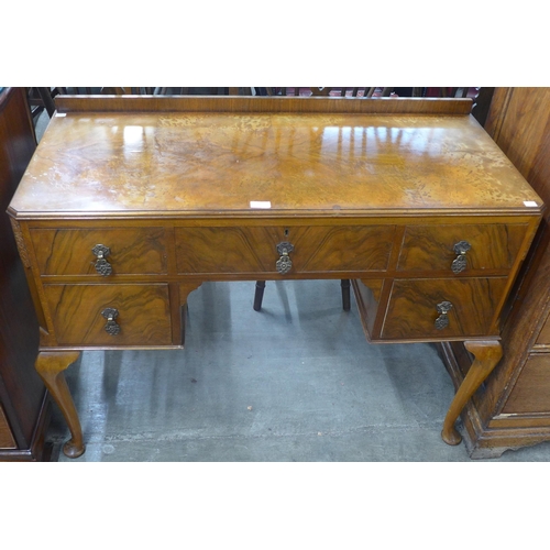 88 - A Queen Anne style figured walnut desk