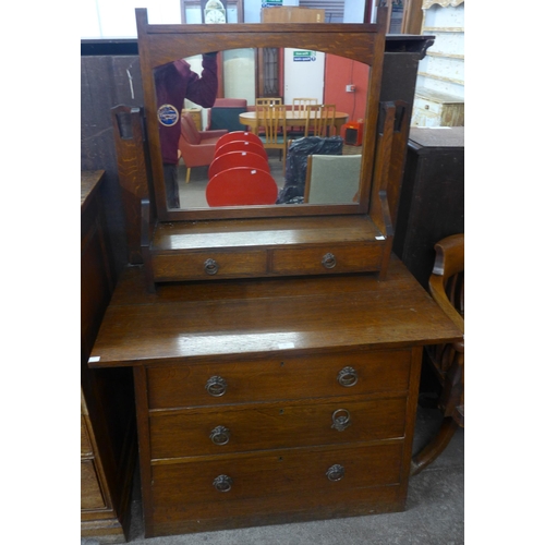 90 - An Arts and Crafts oak dressing table