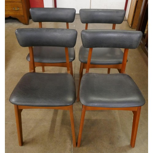 19 - A set of teak dining chairs