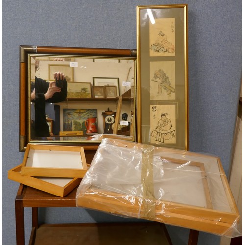 299 - Three oriental drawings on silk, uniformly framed, a mirror and four wooden frames