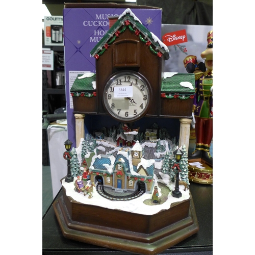 3344 - Festive Musical Cuckoo Clock  (314-268) *This lot is subject to vat