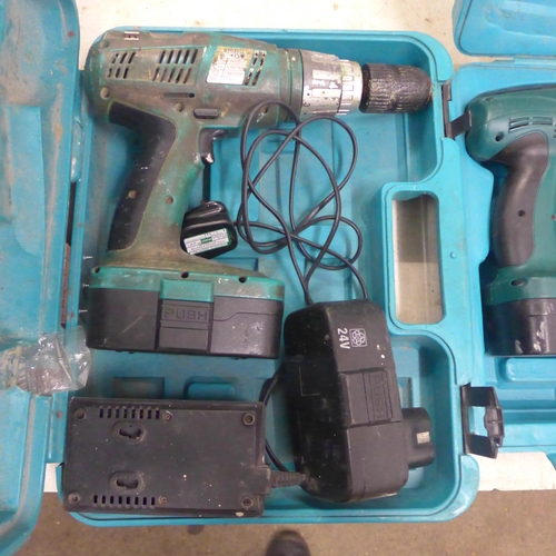 2009 - 3 Boxed power tools - 2 Push 24v cordless drills with batteries and chargers and a 230v hammer drill... 