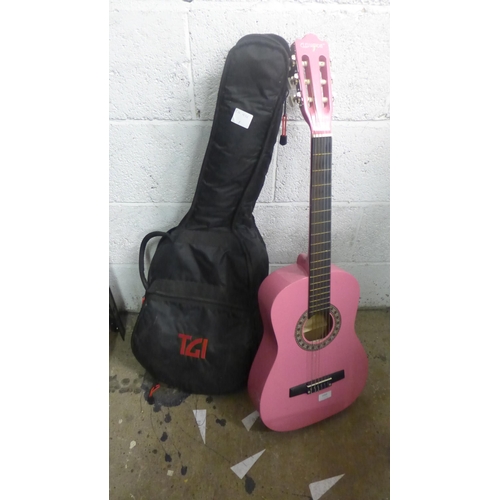 2069 - A pink Elevation acoustic guitar (model 395/4782(D)) with a TGI foam case