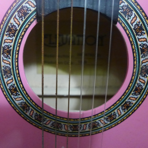 2069 - A pink Elevation acoustic guitar (model 395/4782(D)) with a TGI foam case