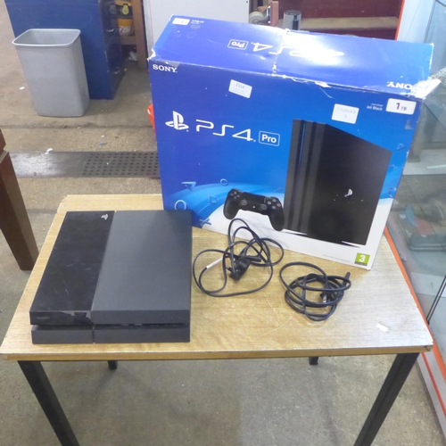 2114 - A PlayStation 4 500GB console, boxed - with power cables, no controller - W