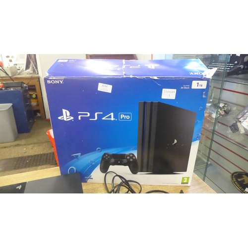 2114 - A PlayStation 4 500GB console, boxed - with power cables, no controller - W