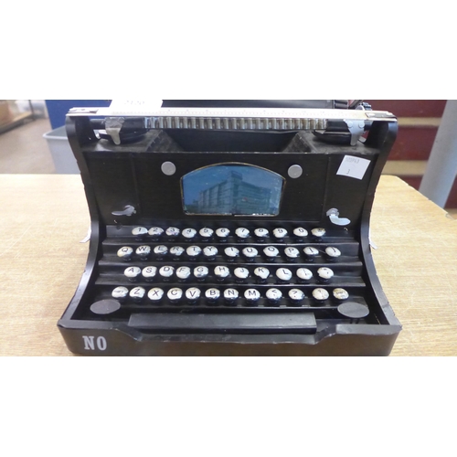 2120 - A tin plate decorative typewriter