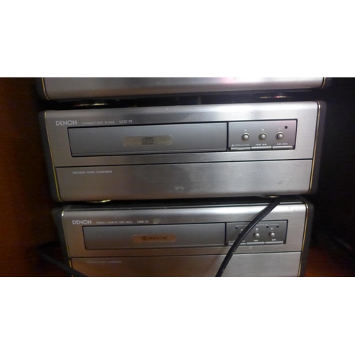 2145 - A wooden cabinet filled with hi-fi equipment including a Denon AM-FM stereo receiver (UDRA-70), a De... 