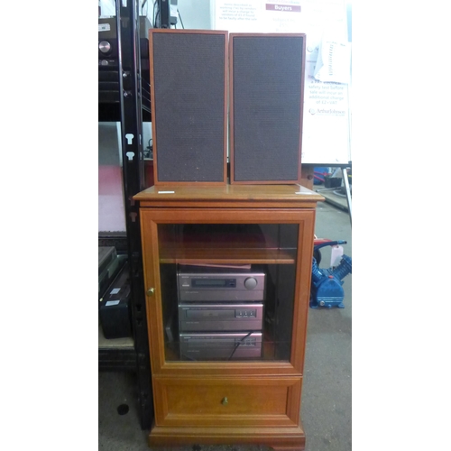 2145 - A wooden cabinet filled with hi-fi equipment including a Denon AM-FM stereo receiver (UDRA-70), a De... 