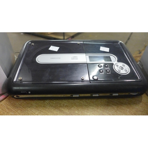 2164 - An Asda Price CD player with box of CDs