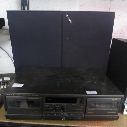 2171 - A Technics stereo cassette deck (RS-TR474M2) with a pair of Sharp speakers (CP-270E)