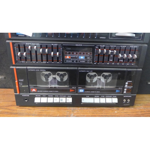 2192 - A Bush 9530 stereo system with an analogue semi-automatic turntable, AM-FM stero tuner, graphic equa... 