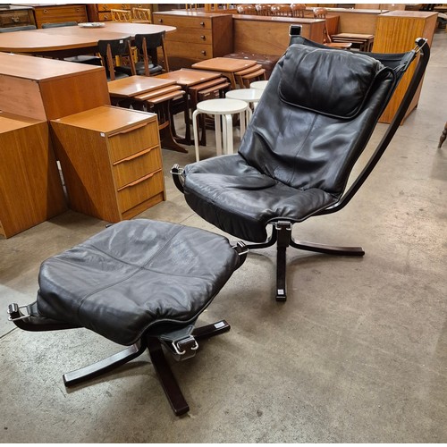 63B - A Sigurd Ressell style beech and brown leather style Falcon chair and ottoman. Please note this lot ... 
