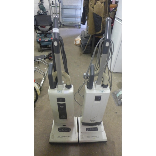 2201 - A Sebo automatic X1 vacuum cleaner and a Sebo automatic X1.1 vacuum cleaner