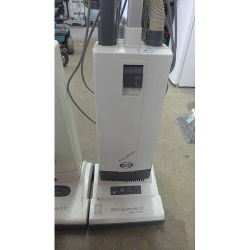 2201 - A Sebo automatic X1 vacuum cleaner and a Sebo automatic X1.1 vacuum cleaner