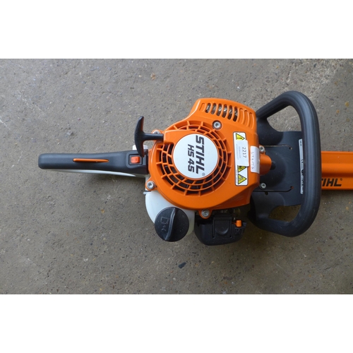 2217 - A Stihl hedge trimmer (HS45) with blade cleaner, fuel and lubricant