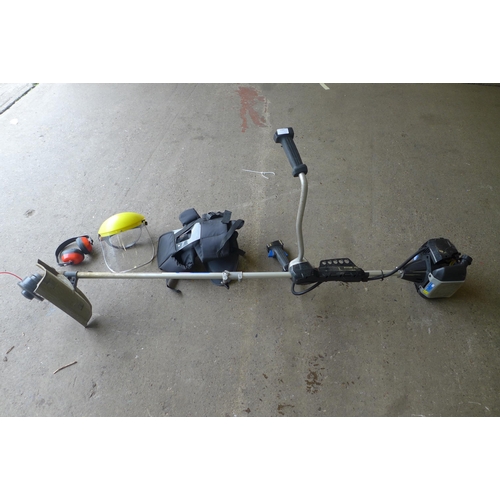 2247 - A MacAllister grass trimmer (MBCP254) with accessories including a harness, a quick start guide, etc... 