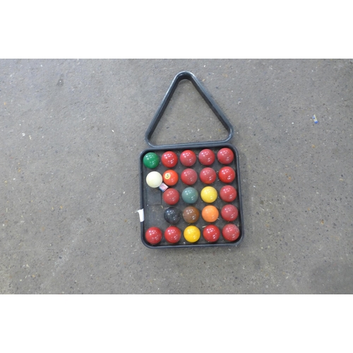 2285 - A set of assorted snooker and pool balls including a cue ball and triangle and a Pro-Score 24