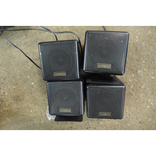 2302 - A Cambridge soundworks four point surround sound speaker system with a TVB2 subwoofer