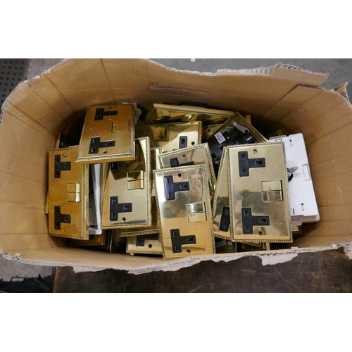 2342 - A large quantity of brass plated double socket wall switches