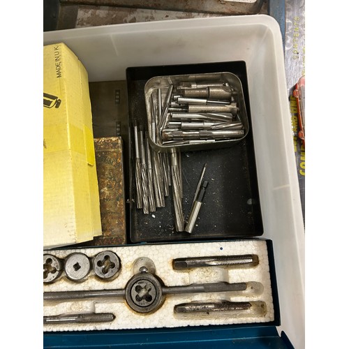 2046 - A box of engineering tools including taps and dies, drill bits, punches, bolt removing kit, etc.