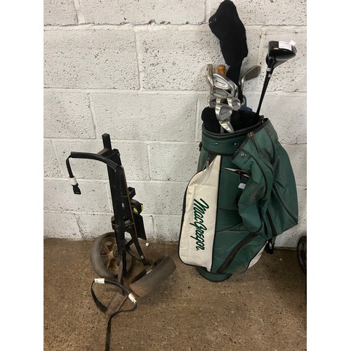 2028 - A Macgregor golf bag with an umbrella, a set of Memphus irons and Memphis No 1,3 and 5 woods and a g... 