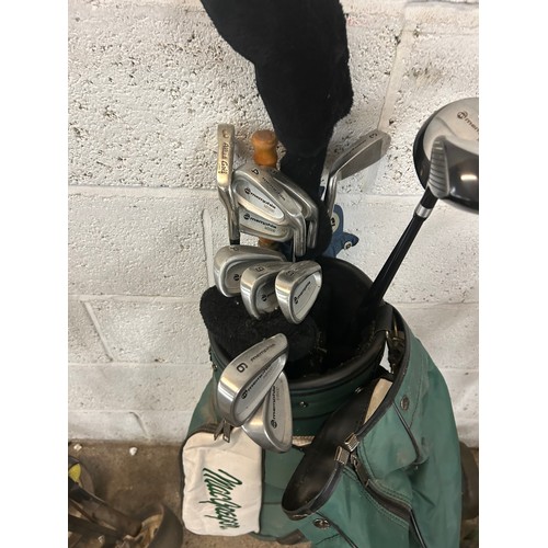 2028 - A Macgregor golf bag with an umbrella, a set of Memphus irons and Memphis No 1,3 and 5 woods and a g... 