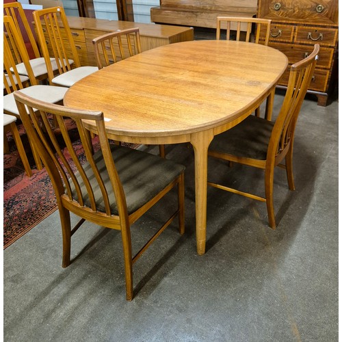 39 - A McIntosh teak extending dining table and four chairs