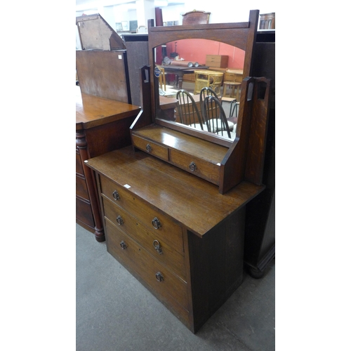 123 - An Arts and Crafts oak dressing table