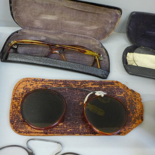 629 - Nine pairs of spectacles including pince-nez