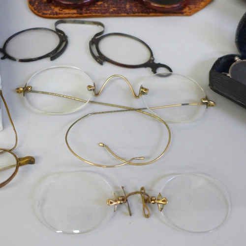 629 - Nine pairs of spectacles including pince-nez